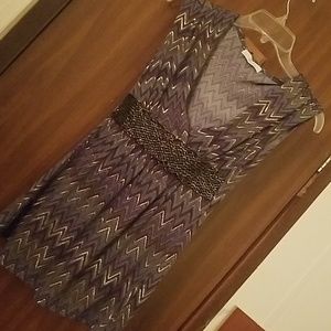 Gray top with gold accents